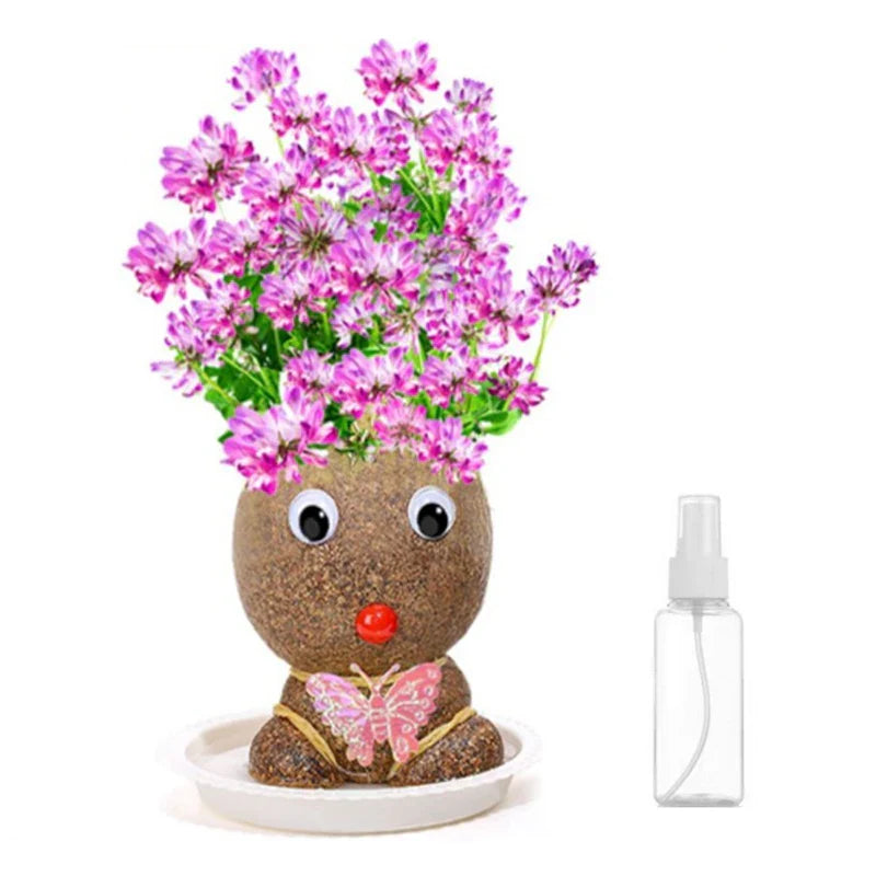 Pink Flower Girl figure with pink and purple blooms beside its included spray bottle