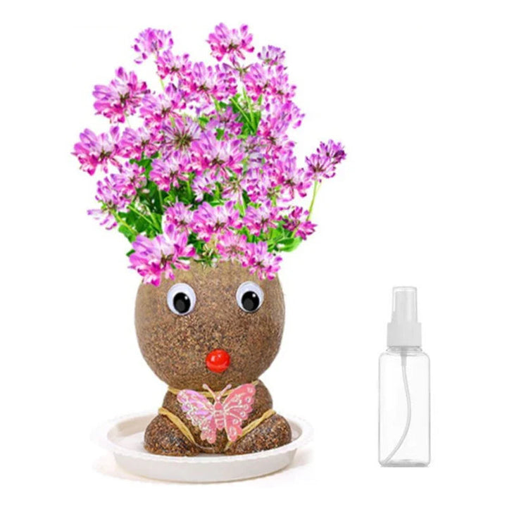 Pink Flower Girl figure with pink and purple blooms beside its included spray bottle