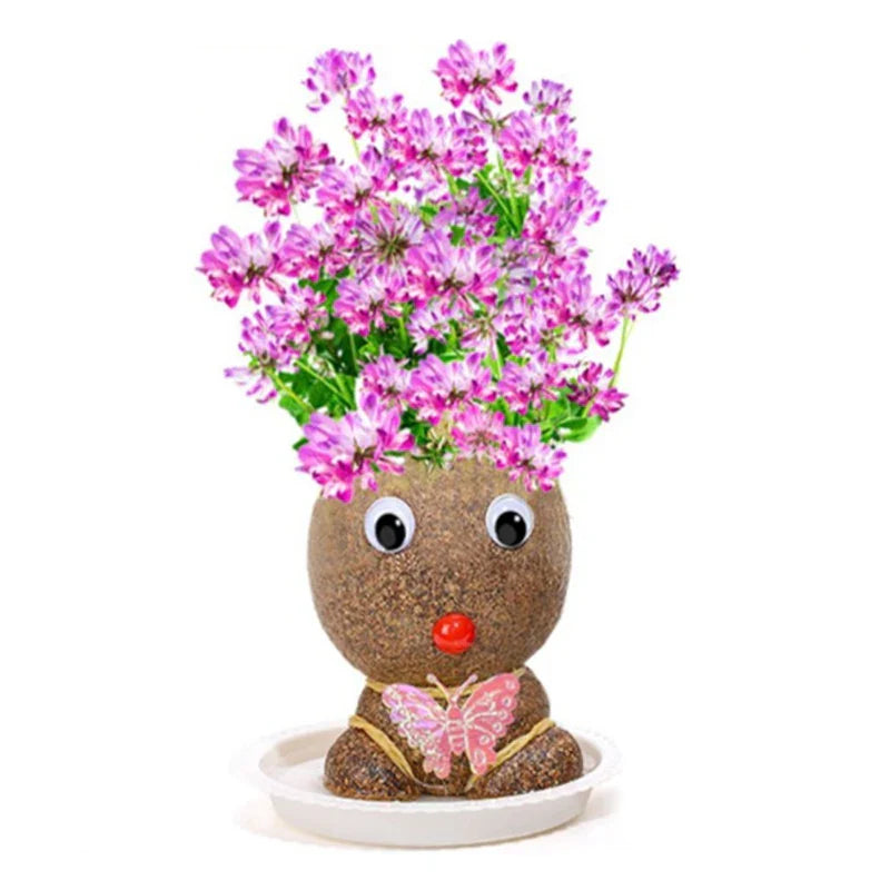 Pink Flower Girl figure with pink and purple blooms and a butterfly decoration in a white bowl