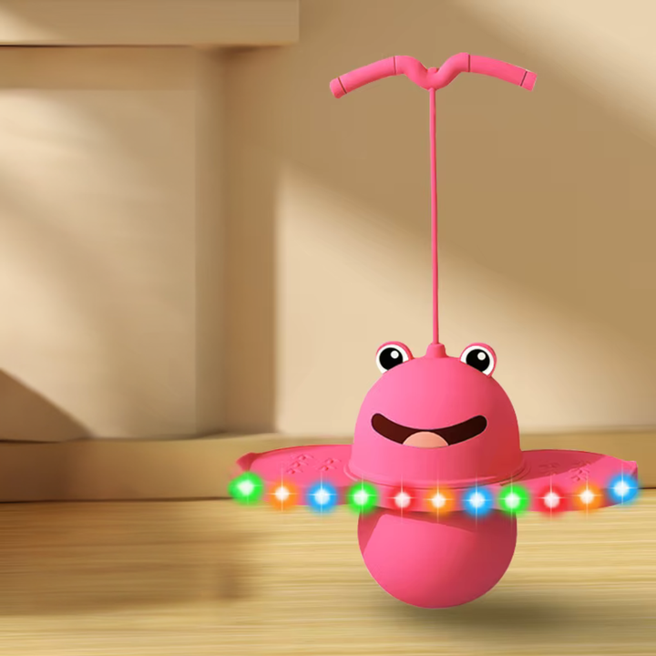 Pink frog pogo stick with multicolored lights along the foot platforms.