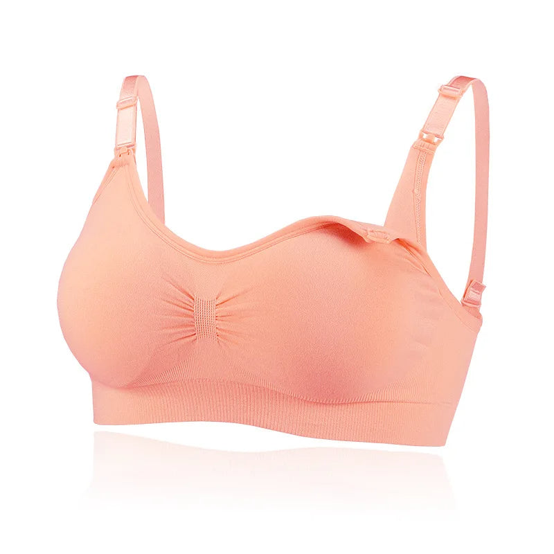 Pink wire-free nursing bra with a gathered front and nursing clips at the straps.