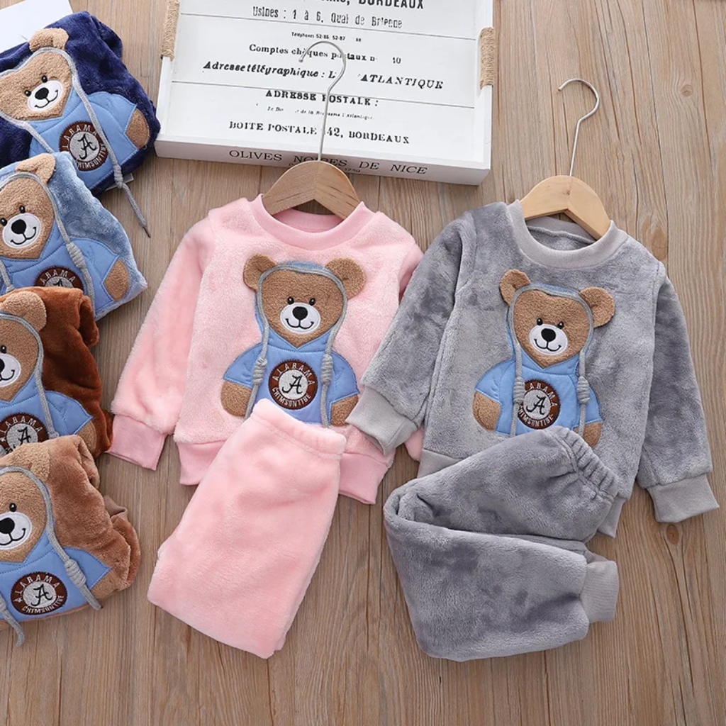 Pink and gray bear sweatshirts with matching pants, with other colors folded beside them