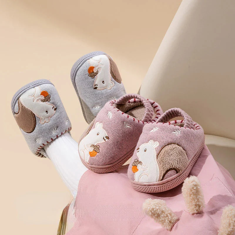 Pink and gray squirrel slippers with plush uppers and soft, rounded openings