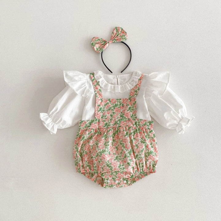 White ruffled top with a pink-and-green floral bodysuit and matching bow headband