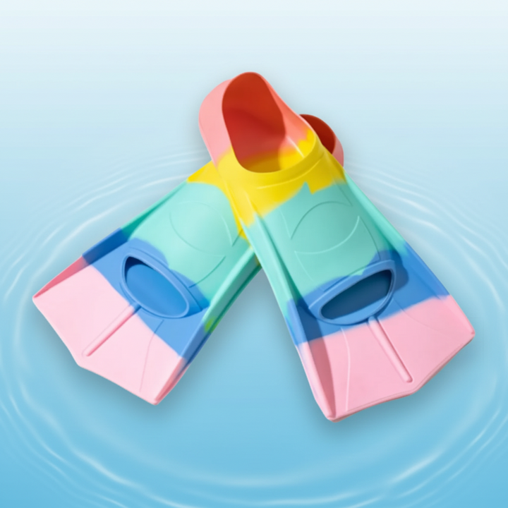 Pink and green short swim fins with multicolor foot pockets and compact blades.