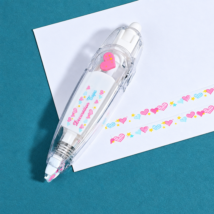 Clear tape dispenser with a pink heart detail beside two rows of pastel heart patterns.