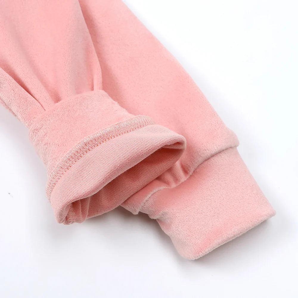 Pink hoodie sleeves with one cuff turned back to show the inner fabric