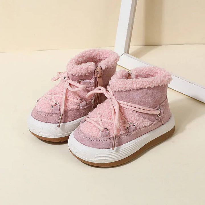 Pink winter boots with fluffy collars, front laces, and contrasting white and brown soles