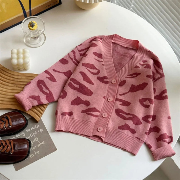 Pink leopard-pattern V-neck cardigan with buttons, long sleeves and ribbed trim.