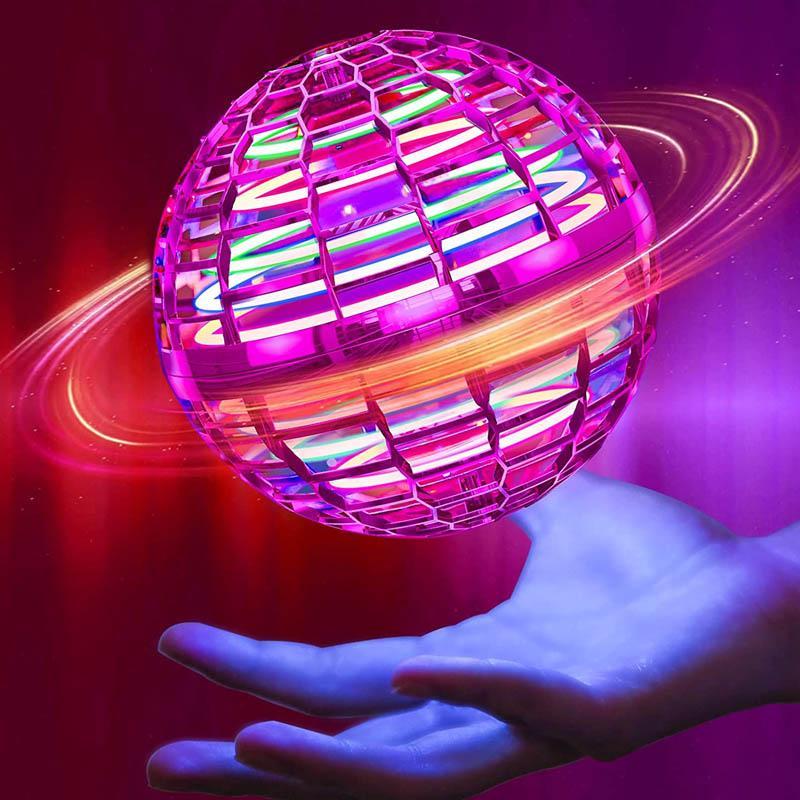 Pink mini drone ball with multicolored lights shown above an open hand
