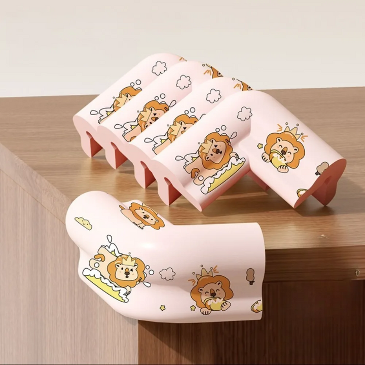 Five pink lion-print corner covers, including one fitted over a wooden furniture corner.