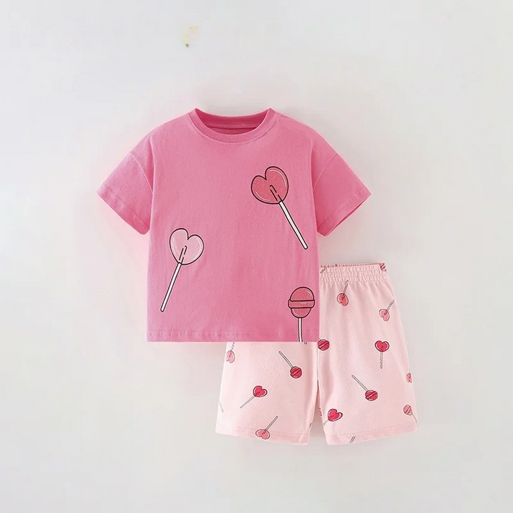 Pink lollipop-graphic T-shirt paired with pale pink candy-print shorts