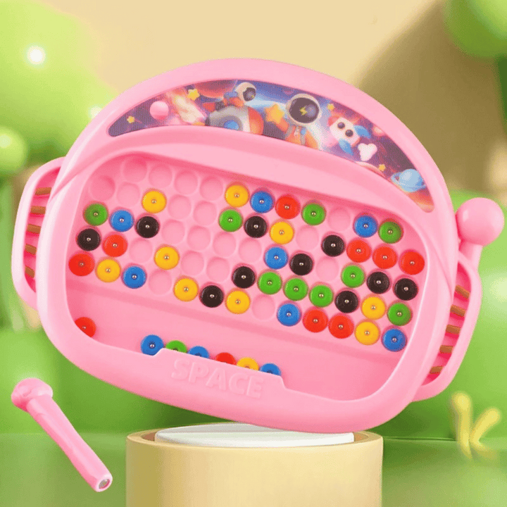 Pink magnetic drawing board with colorful beads and a matching pen