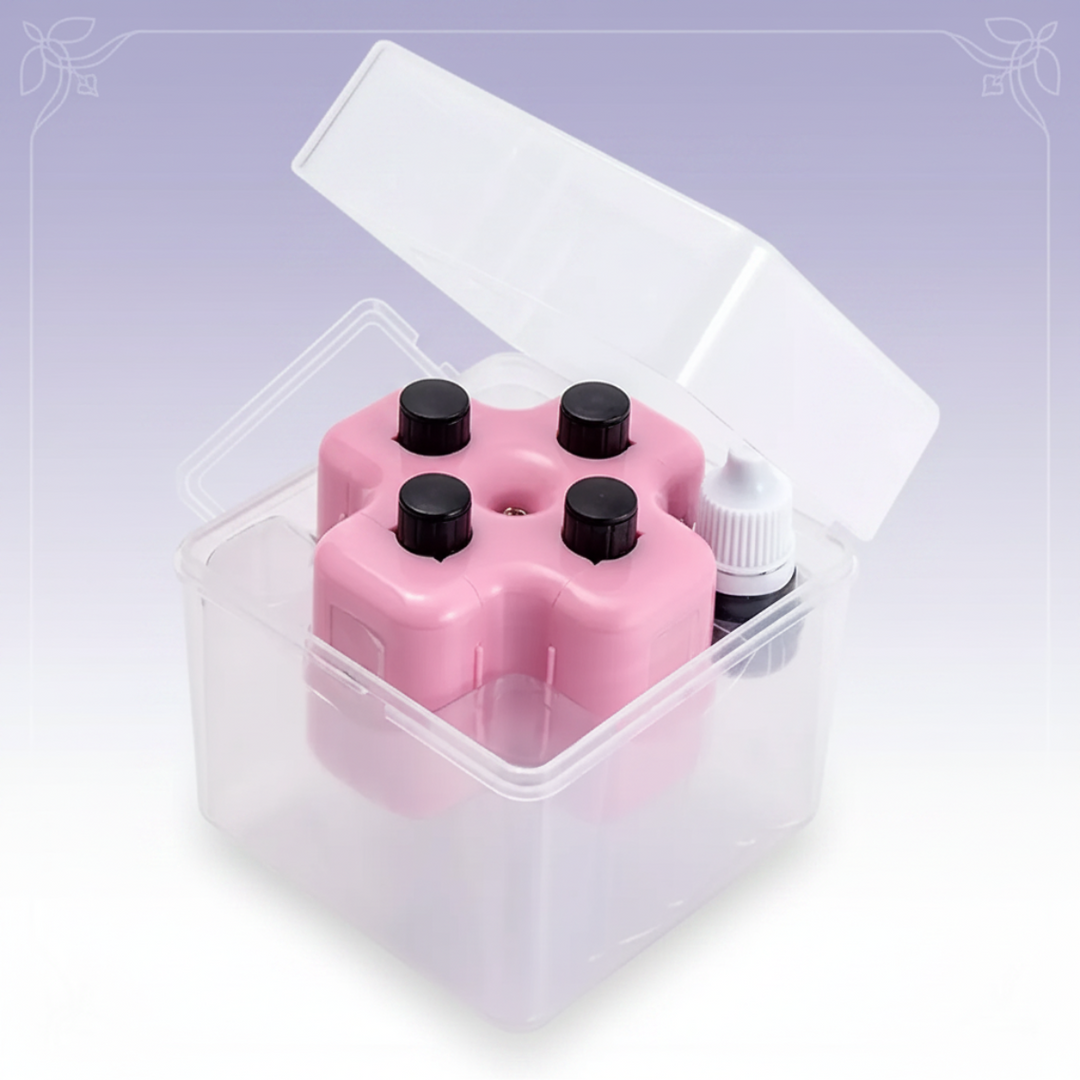 Pink math roller set and ink bottle in an open clear storage case.