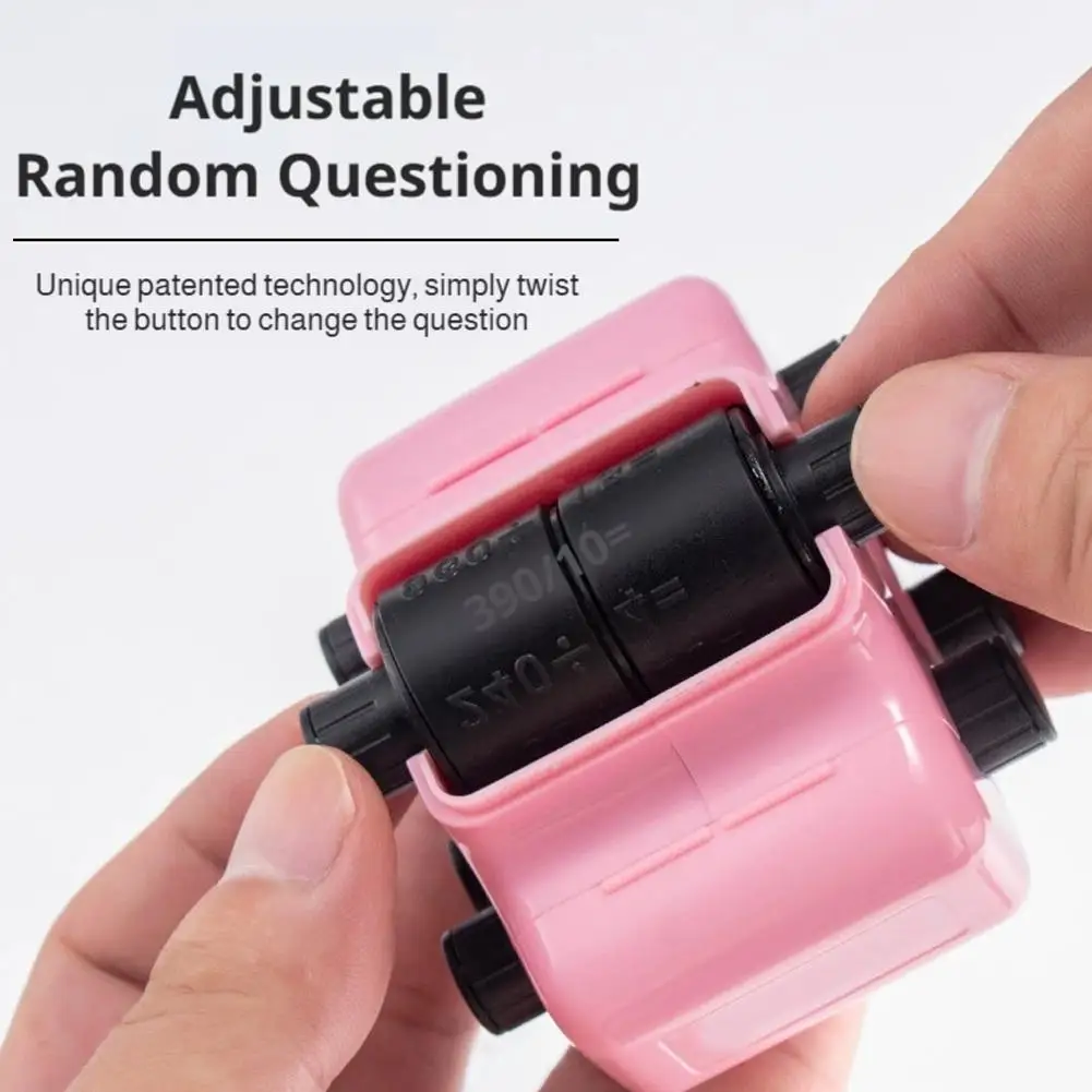 Hands turning a side knob on a pink math roller stamp to adjust the printed problems.