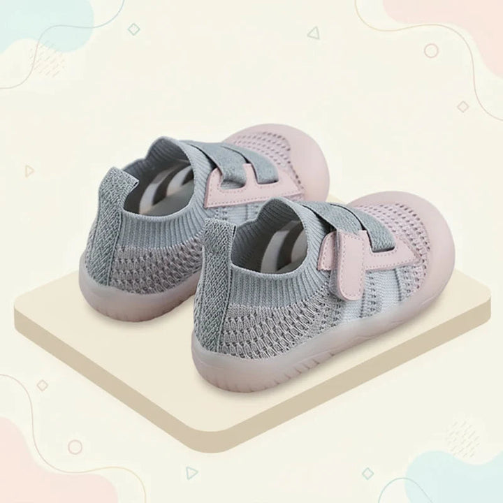 Pink and gray mesh baby shoes shown from the side and back