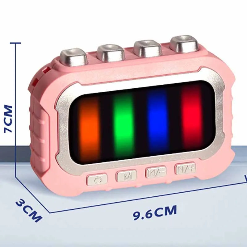 Pink musical fidget game with dimensions of 9.6 cm wide, 7 cm high, and 3 cm deep.