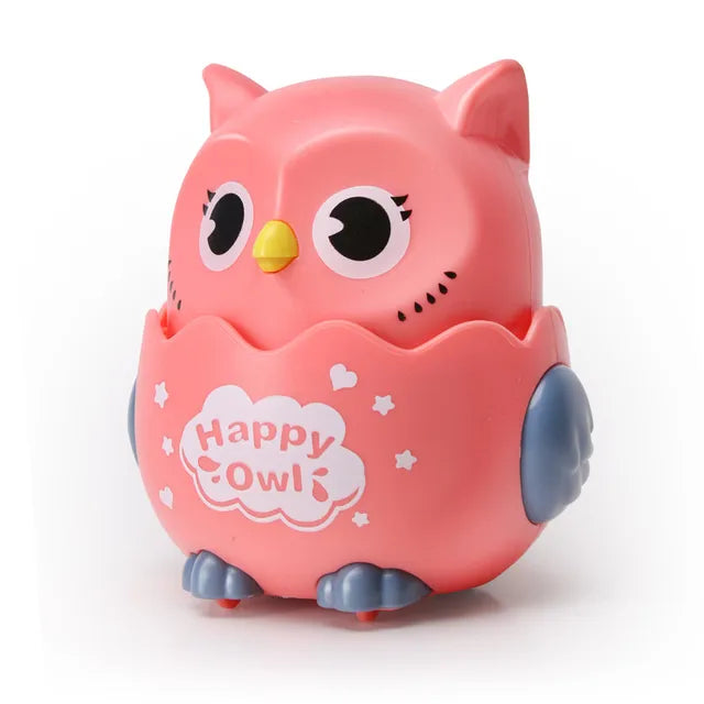 Pink owl toy car with gray wings and feet and a yellow beak.