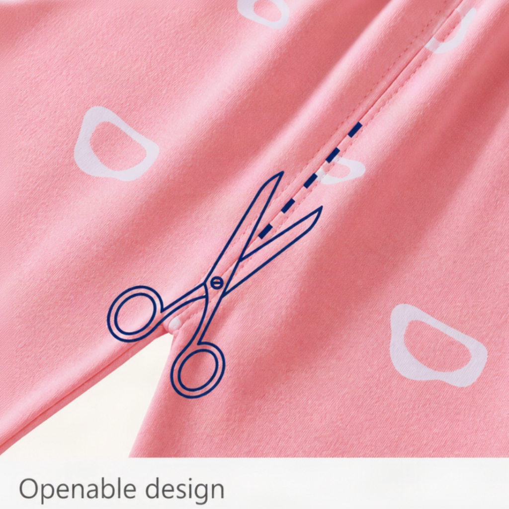 Pink pajama fabric close-up with a scissors illustration along a seam