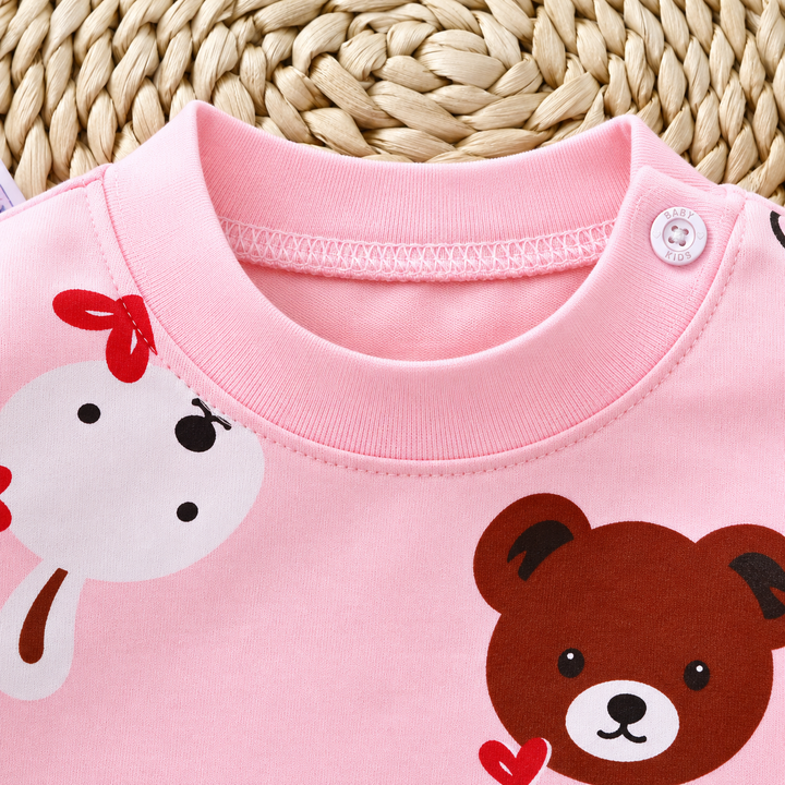Round neckline and shoulder button detail on the pink bear and rabbit pajama top