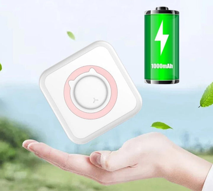 Pink-accented mini photo printer shown above a hand beside a 1000 mAh battery graphic