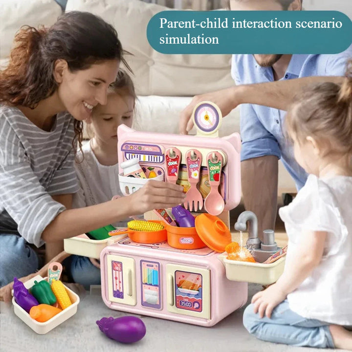 Children and adults playing with a pink kitchen set and toy vegetables