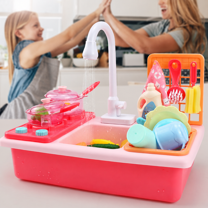 Pink toy kitchen in front of two people sharing a high-five