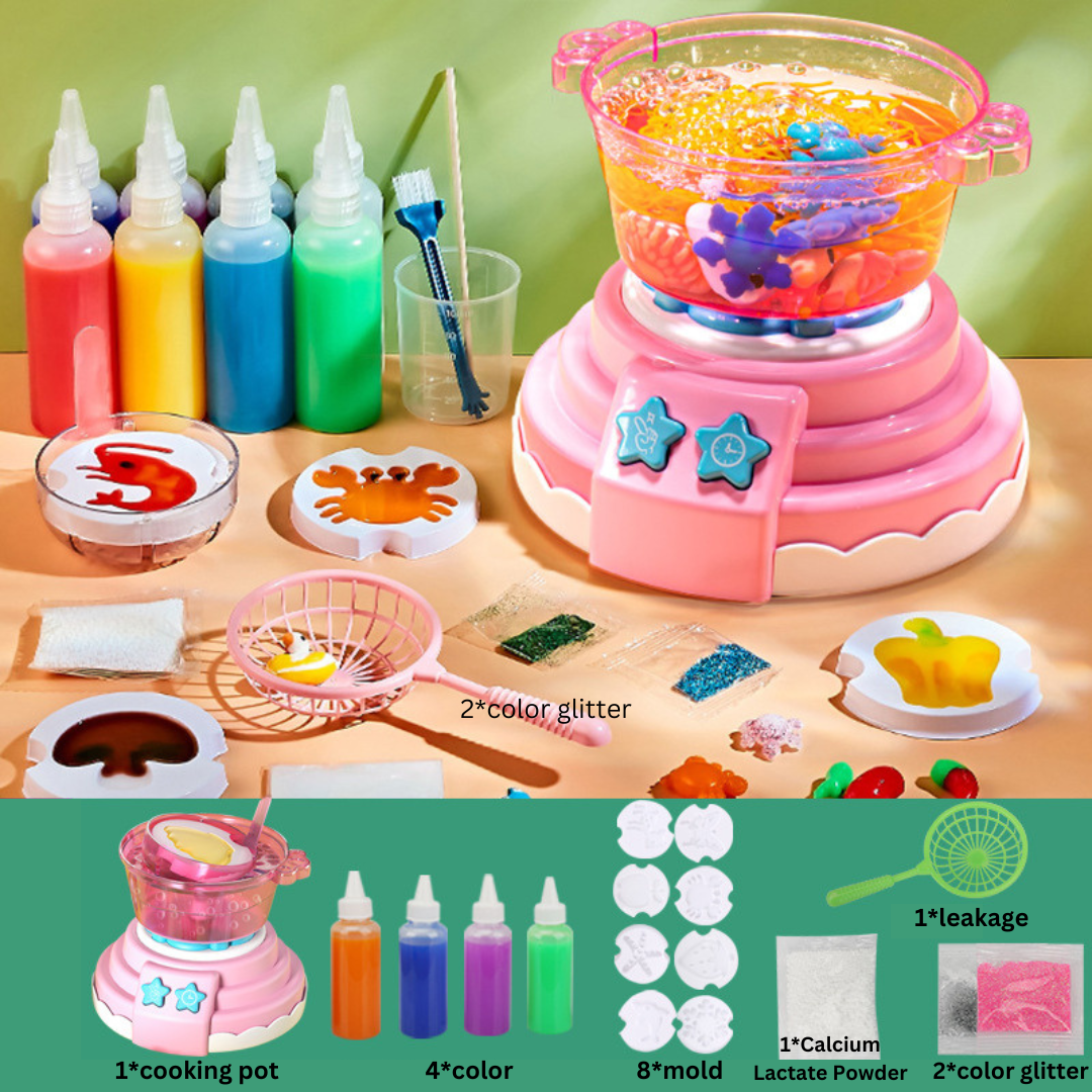 Pink cooking pot craft kit shown with color bottles, figure molds, glitter, and a scoop net