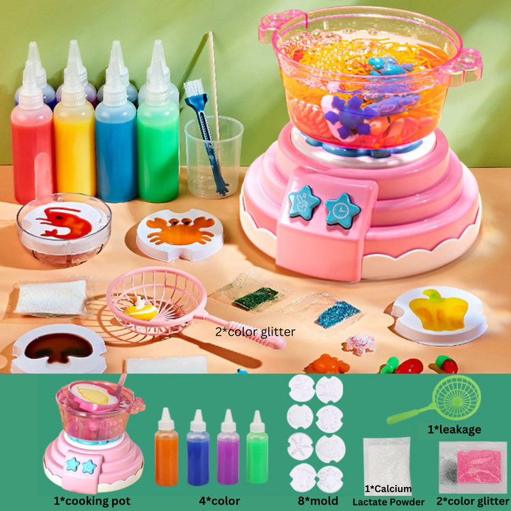 Pink cooking pot craft kit shown with color bottles, figure molds, glitter, and a scoop net