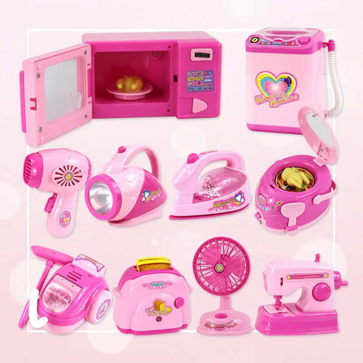 Pink pretend household appliances including a microwave, washer, iron, vacuum, and sewing machine