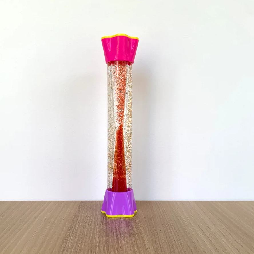 Red glitter sensory tube with a pink top and purple base