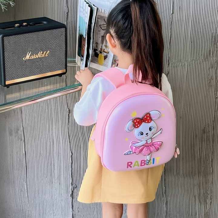 Rear view of a child wearing a pink rabbit backpack
