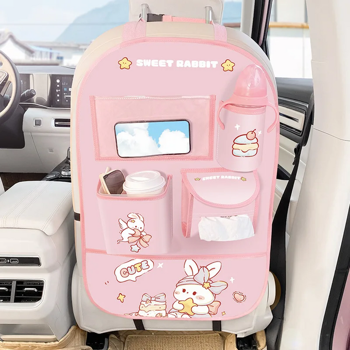 Pink rabbit backseat organizer holding a device, bottle, cup and tissues