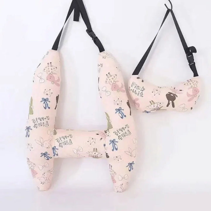 Pink rabbit-print H-shaped car pillow and matching neck pillow with black hanging straps