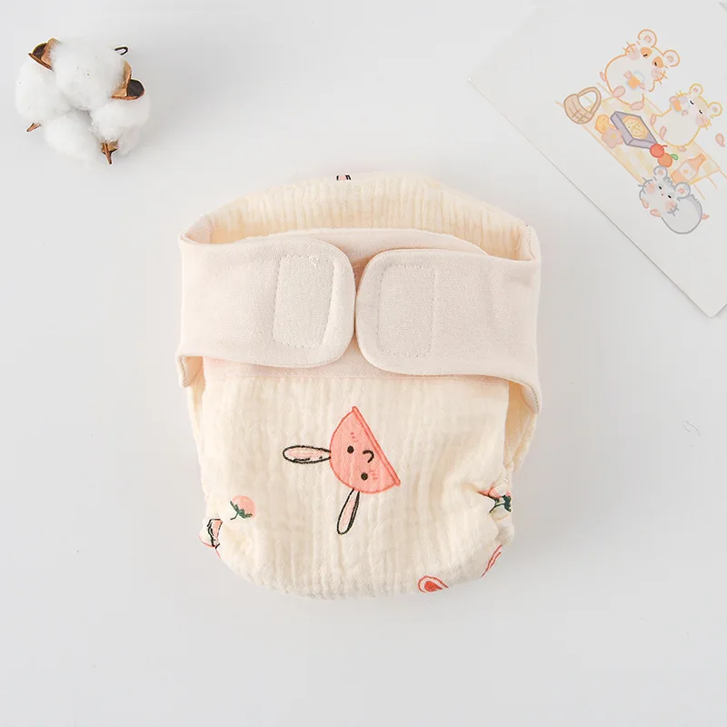 Cloth diaper with a pink rabbit illustration and small cherry details