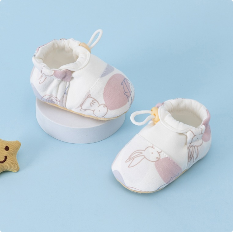 Pink rabbit-print baby shoes with rounded toes and back pull loops