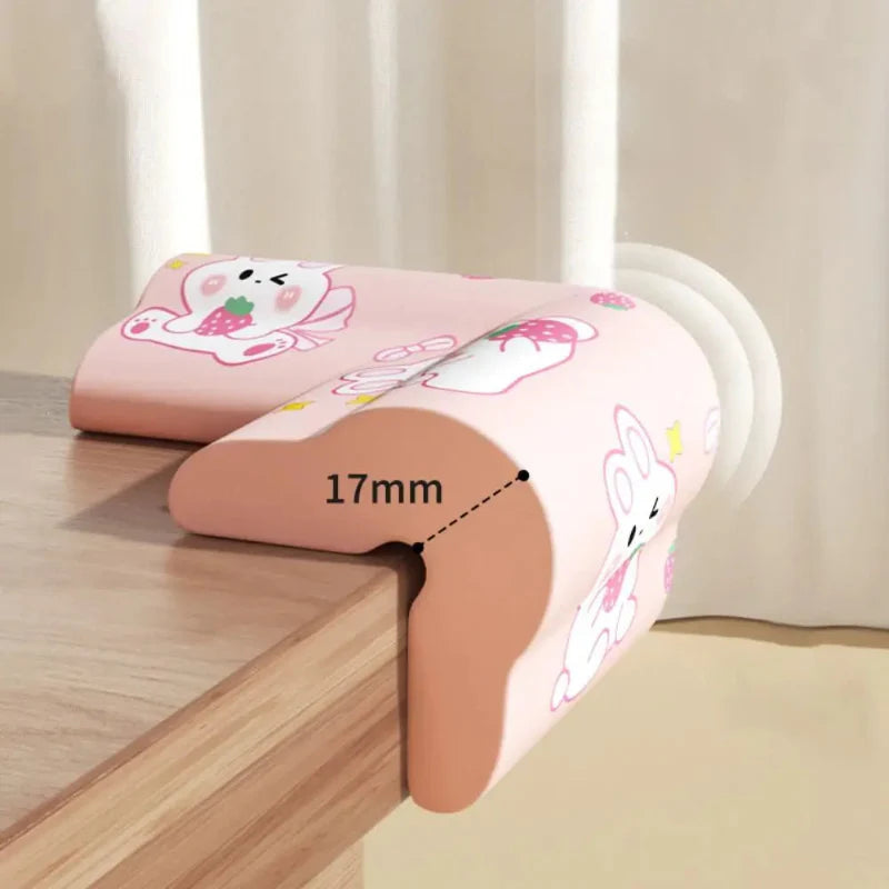 Pink rabbit-print corner cover fitted to a table, with a 17 mm measurement marked.