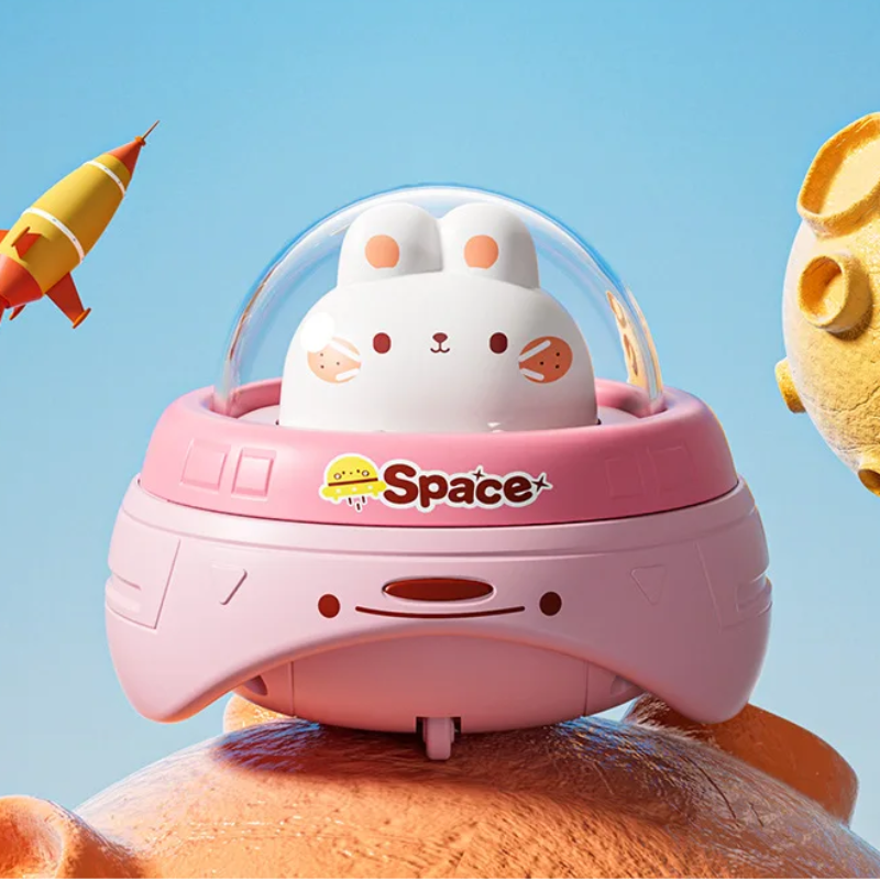 Pink rabbit UFO toy with a clear dome and curved pink body.