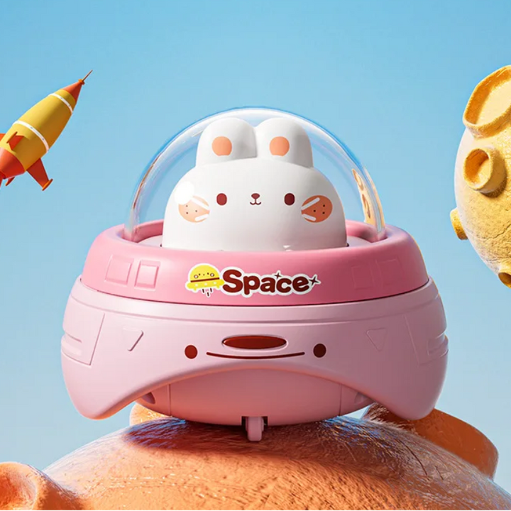 Pink rabbit UFO toy with a clear dome and curved pink body.