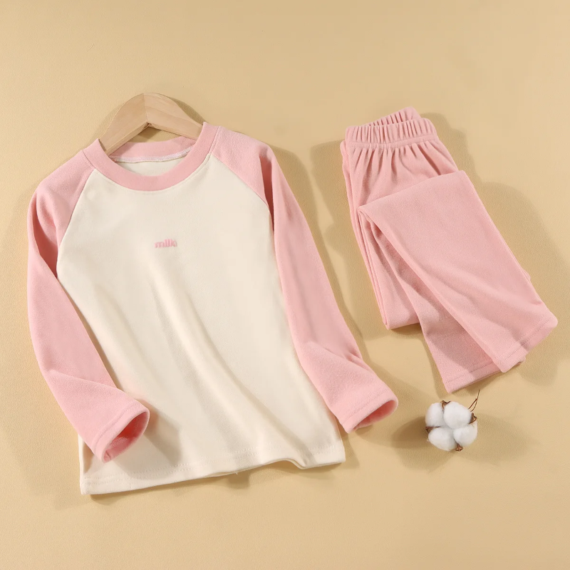 Pink pajama set with a cream-front raglan top and matching elastic-waist pants.