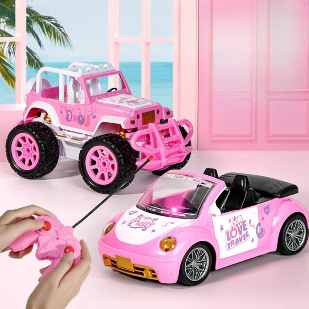 Pink RC convertible and off-road vehicle beside hands holding a remote controller.