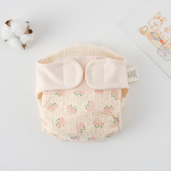 Cloth diaper with small pink rose prints and green leaves