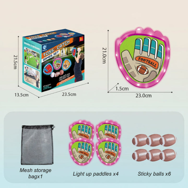 Pink rugby-style catch set with four paddles, six oval balls, and a mesh bag