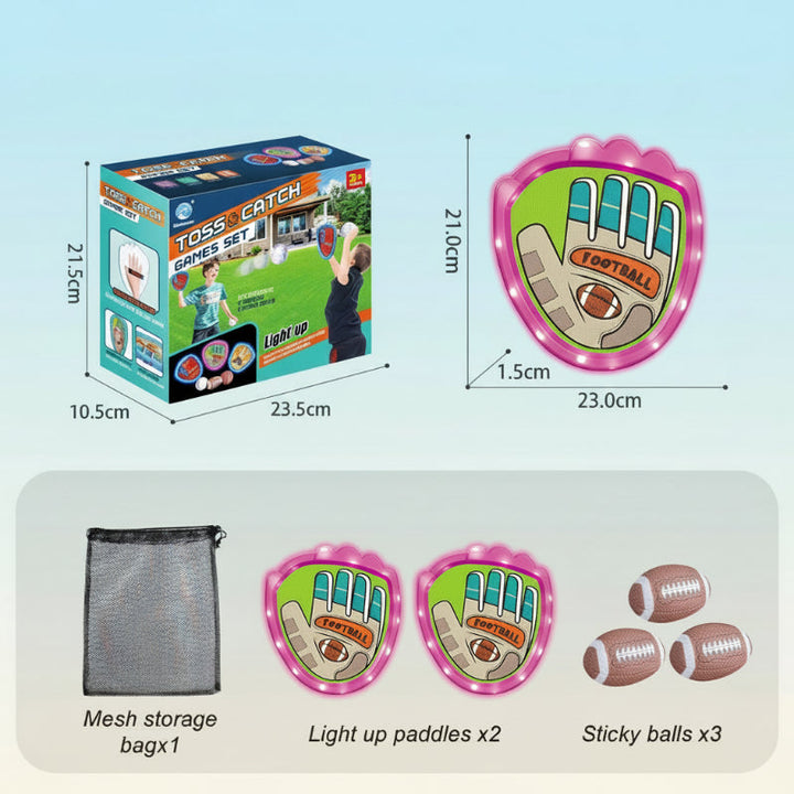 Pink rugby-style catch set with two paddles, three oval balls, and a mesh bag