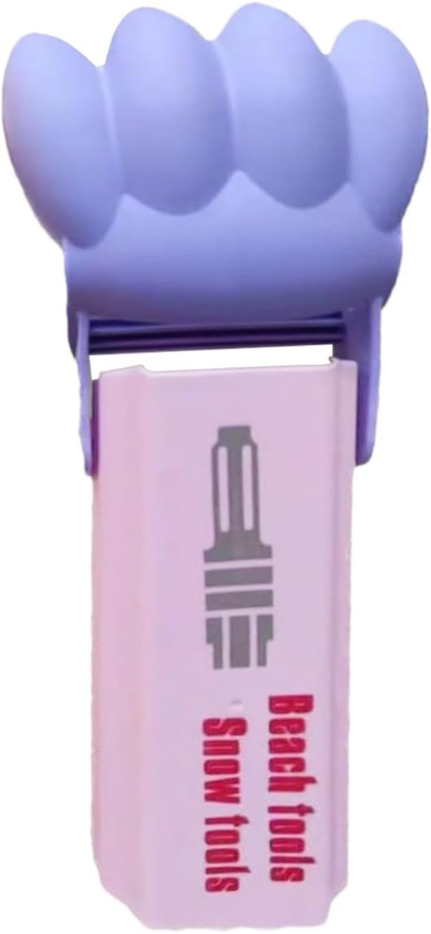 Pink sand grabber with a raised purple scoop against a white background