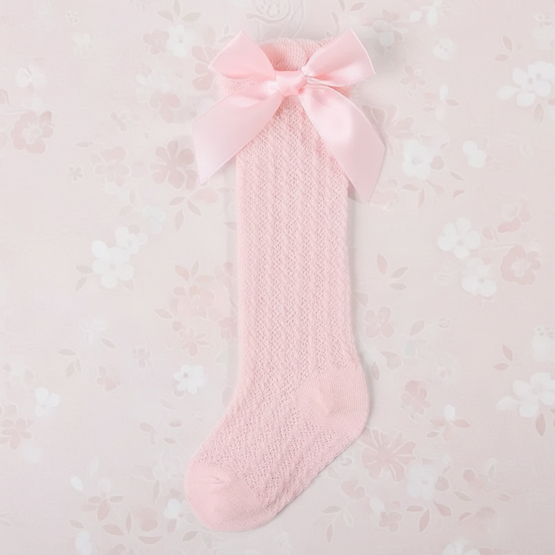 Pink pointelle knee-high sock with a matching satin bow