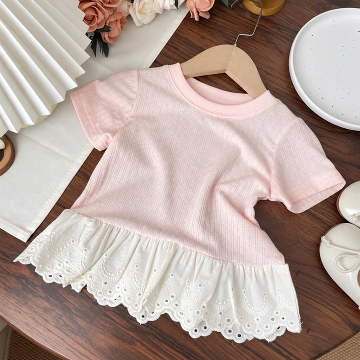 Pink short-sleeve cotton T-shirt with a white scalloped lace hem.