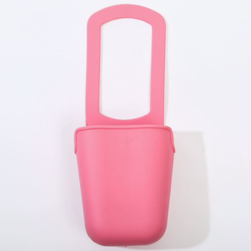 Pink silicone cup holder shown from the front with its attachment loop above the cup section.