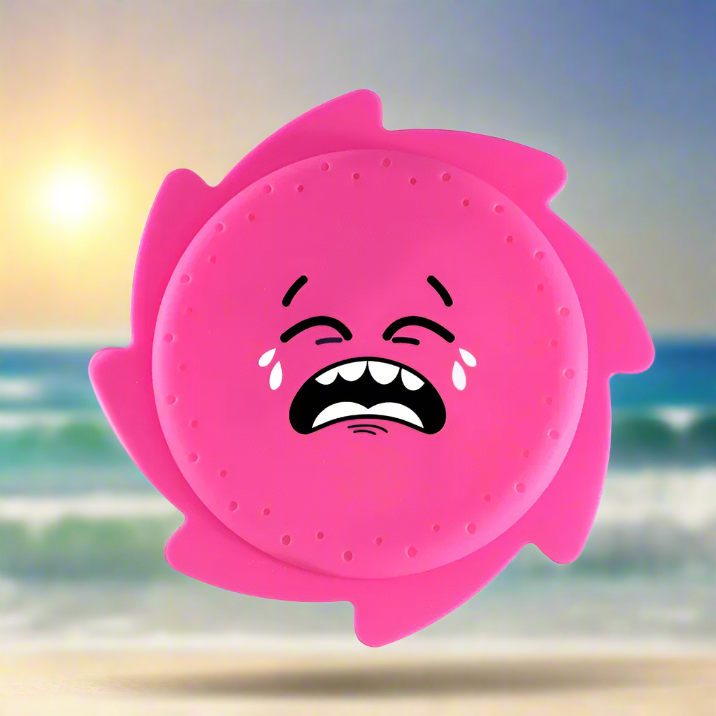 Pink silicone water flying disc with a crying cartoon face