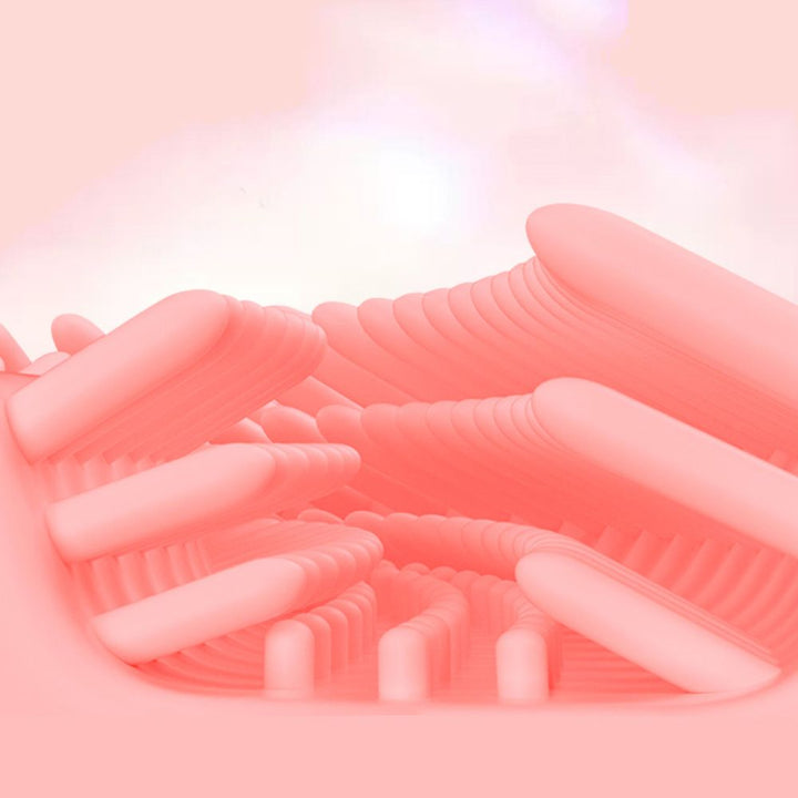 Close-up of soft pink silicone bristles inside the U-shaped toothbrush head